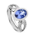 Pierścionek z białego złota z tanzanitem zakutym na gładko