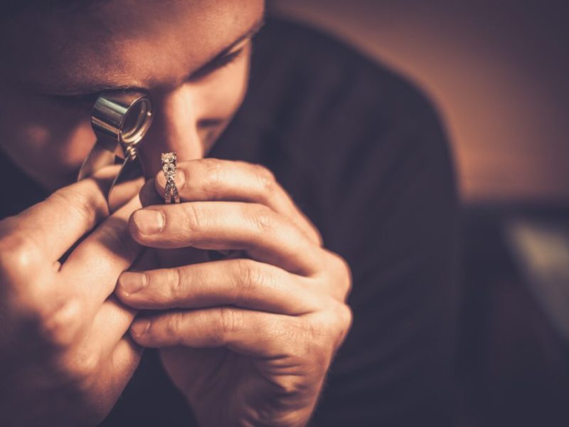 Portrait of a jeweler during the evaluation of jewels.